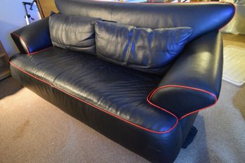 Retro 90's Black Leather Sofa With Red Trim And Removable Cushions That Zipper On