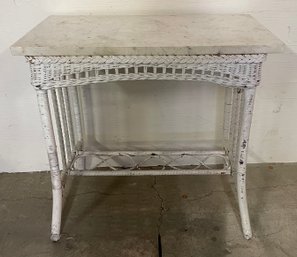 Wicker Table With Mismatched Marble Top