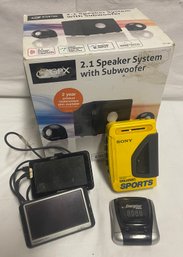 Lot Of Various Electronics Including Sony Walkman Sports And Two Garmin GPS