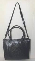 A36. Patricia Nash Black Leather, Medallion Embossed Handbag.