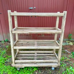 An Antique Outdoor Potting Shelf With Wheels- Shed