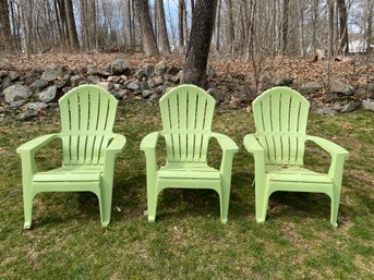 Three Green Adirondack Chairs
