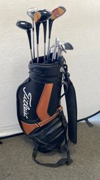 A TITLEIST Golf Bag W/ Clubs, Woods: Taylor Made 1,2,3,4 Irons: MacGregor Tommy Armour 2,4,5,6,7,8,9 & More