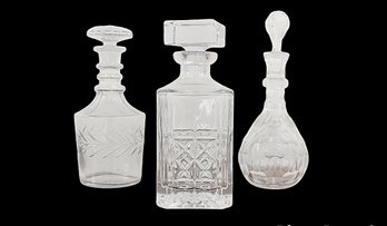 Three Crystal Decanters Including One Waterford