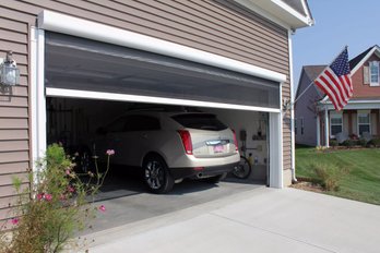 A Motorized Retractable Garage Screen Door With Remote Control