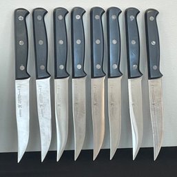 A Set Of 8 JA Henckels Steak Knives