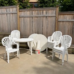 A Set Of 15 White Plastic Outdoor Chairs And 3 Tables