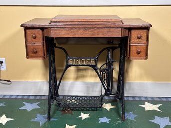 A Vintage Singer Treadle Sewing Machine In Oak