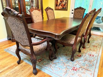 A Carved Cherry Extendable Dining Room Table And Set Of 6 Chairs - With Table Pads - By Michael Amini