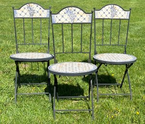 A Trio Of Pique Assiette Folding Bistro Chairs