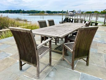 A Henry Hall Teak Table With 7 Chairs