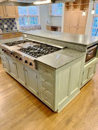 A Custom Oak Double Height Island With Granite Counter