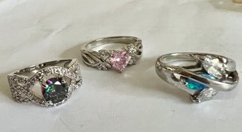 THREE SILVER TONE RINGS MYSTIC TOPAZ, PINK HEART AND OPAL AND WHITE STONE