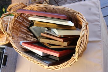 Wicker Basket With Tons Of Picture Frames