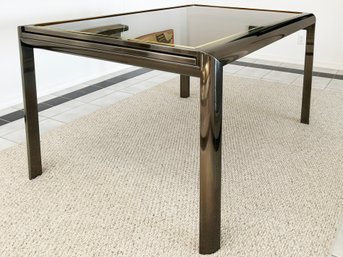 A Vintage Modern Smoked Glass, Brass, And Chrome Extendable Dining Table In Style Of Romeo Rega, C. 1970's
