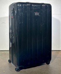 A Tumi Rolling Suitcase