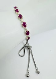 OVAL FACETED RUBY STERLING SILVER LINK BRACELET