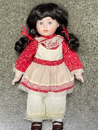 Porcelain Doll In Red