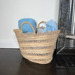 A Handled Beach Basket With Turkish Beach Towels