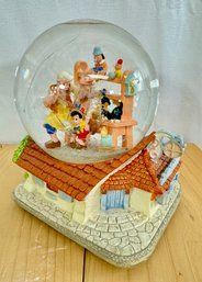 A Walt Disney's Pinocchio 'When You Wish Upon A Star' Musical Snow Globe