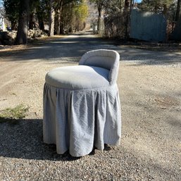 An Upholstered Swivel Vanity Seat