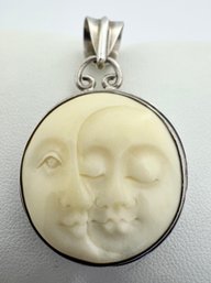 DOUBLE MOON FACE STERLING SILVER PENDANT