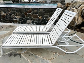 Pair Of White Patinated Aluminum And Vinyl Chaise Lounge Chairs
