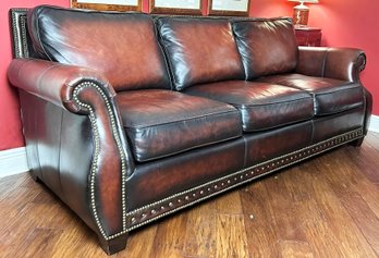 A Tawny Leather Rolled Arm Sofa By Bernhardt Furniture