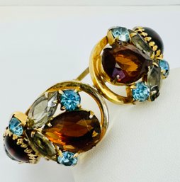 VINTAGE JULIANA GOLD TONE BLUES AND TOPAZ CLAMPER BANGLE BRACELET