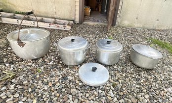 Aluminum Ware Stock Pots In Different Styles And Various Sizes And One Extra Top Lid.