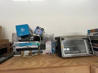 MISC ELECTRONICS INCLUDES TOASTER OVEN, NETGEAR, TV WALL MOUNTS, ETC.