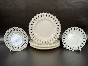 An Assortment Of Vintage Milk Glass Plates With Lace Rims