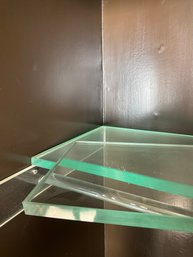 A Collection Of Glass Closet Shelves With Glass Rods