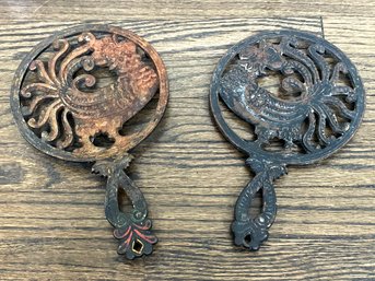 A Pair Of Antique Cast Iron Trivets