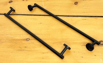 A Pair Of Black Metal Towel Bars