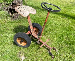 A Tractor Seat On Wheels