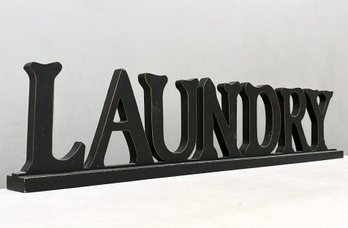 A Painted Wood Laundry Sign