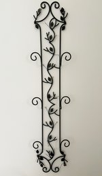 A Wall Mount Plate Rack With Leaf Decorative Details
