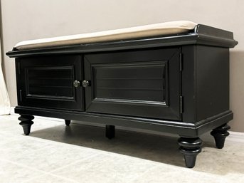 A Painted Wood Storage Bench With Custom Cushion