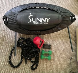 A Fitness Trampoline, Jump Rope, And Assorted Weights