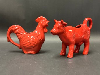 A Pair Of Farmhouse Creamers In Red Ceramic: Rooster & Cow