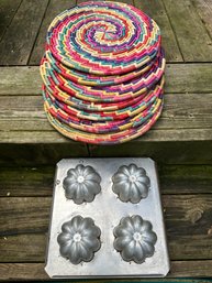 Antique Bread/cake Mold Paired With Seven Woven, Brightly Colored Round Placemats