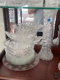 LARGE CUT CRYSTAL VASE AND THREE CUT CRYSTAL BOWLS