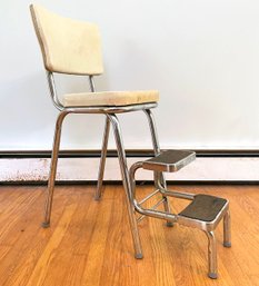 A Vintage Kitchen Stool With Fold Out Steps