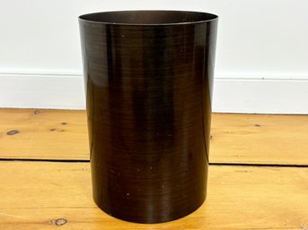 An Acrylic Wastebasket