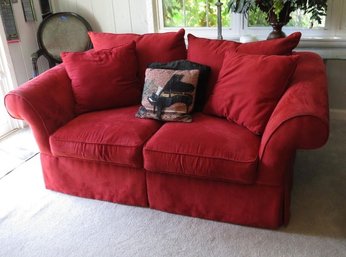 A Red Love Seat By HM Richards Of Baldwyn, MIssissippi.