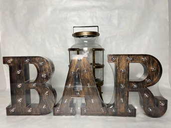 Illuminated B.A.R. Letters And A Glass Drink Dispenser