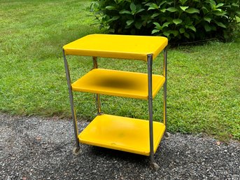 A Vintage Yellow Tiered Enamel Cart