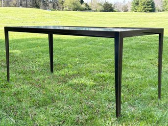 A Modern Bronzed Cast Iron Glass Top Dining Table