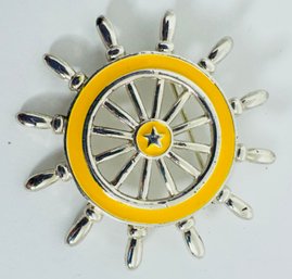 DANECRAFT YELLOW ENAMEL SHIPS WHEEL BROOCH